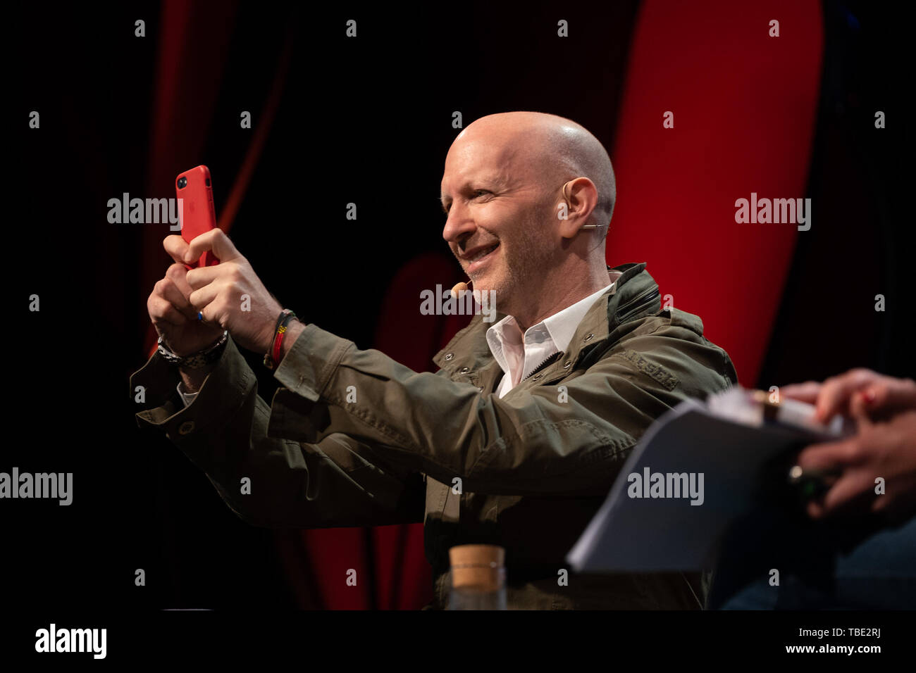 The Hay Festival, Hay on Wye, Wales UK , Saturday 01 June 2019.   Simon Sebag Montefiore, historian and writer, takes a photo of the audience from the stage  at the 2019 Hay Festival   The festival, now in its 32nd year, held annually in the small town of Hay on Wye on the Wales - England border,  attracts the finest writers, politicians and intellectuals from  across the globe for 10 days of talks and discussions, celebrating the best of the written word and critical debate  Photo © Keith Morris / Alamy Live News Stock Photo