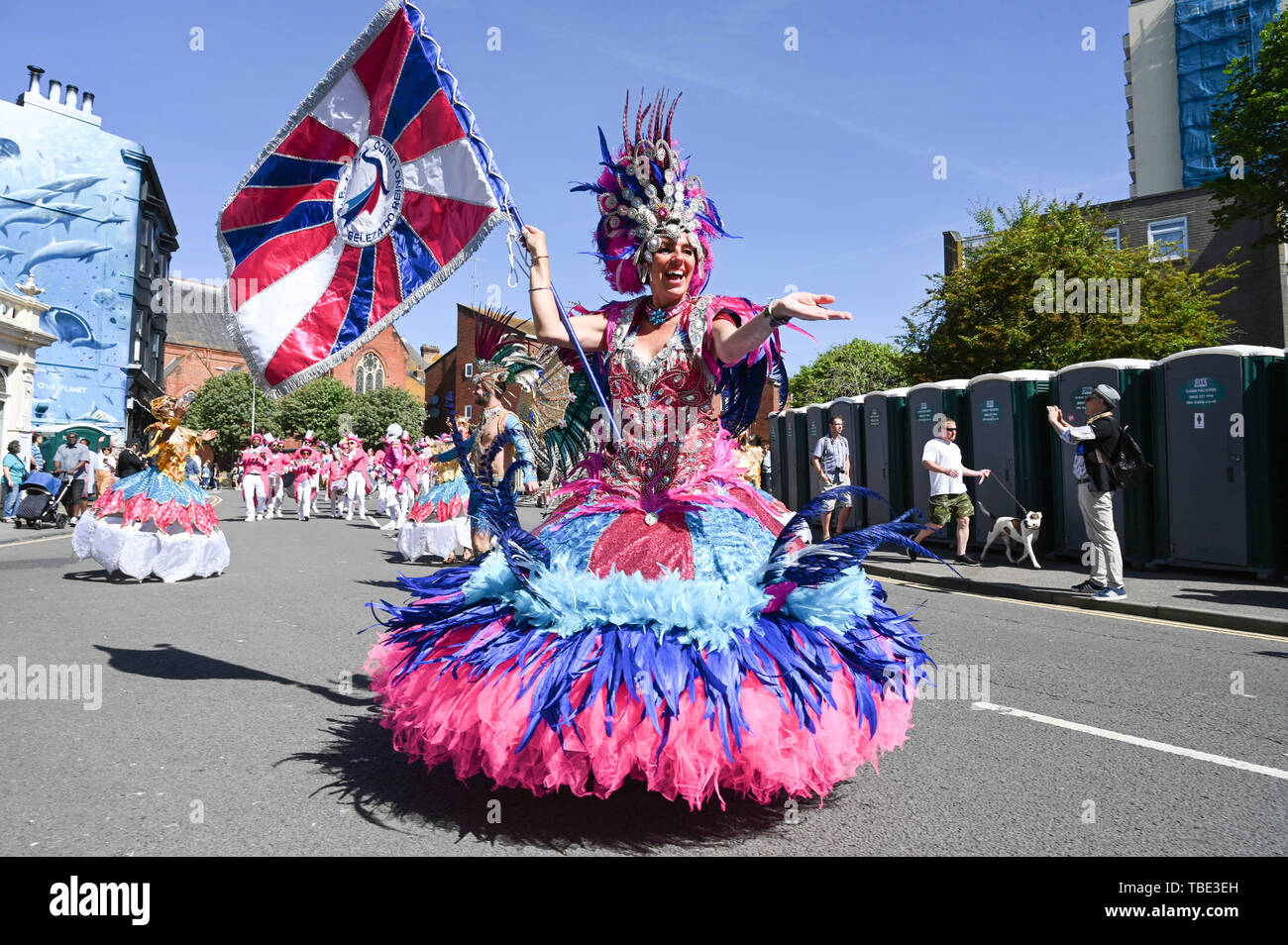 Brighton UK 1st June 2019 - Thousands of people enjoy the Kemptown Carnival parade in Brighton on a beautiful hot sunny day with temperatures expected to reach into the high twenties in some parts of the South East. Thousands are expected to attend the annual carnival in the city after a gap of two years with live music , food stalls and activities taking place throughout the day until ten in the evening . Credit : Simon Dack / Alamy Live News Stock Photo