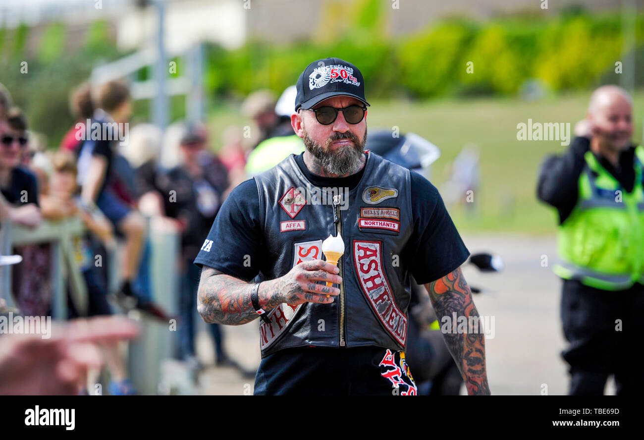 Brighton UK 1st June 2019 - Time for an ice cream as hundreds of Hells Angels gather on Brighton seafront as part of the clubs 50th anniversary celebration weekend . Over 3000 bikers from  around the world gathered in Surrey before heading down to Brighton today  . Credit : Simon Dack / Alamy Live News Stock Photo