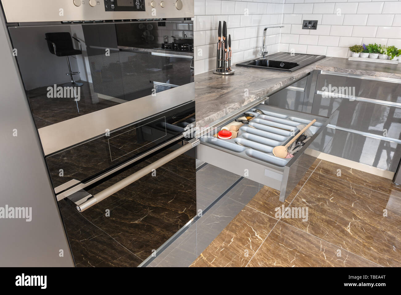 Luxury modern white, beige and grey kitchen interior Stock Photo - Alamy