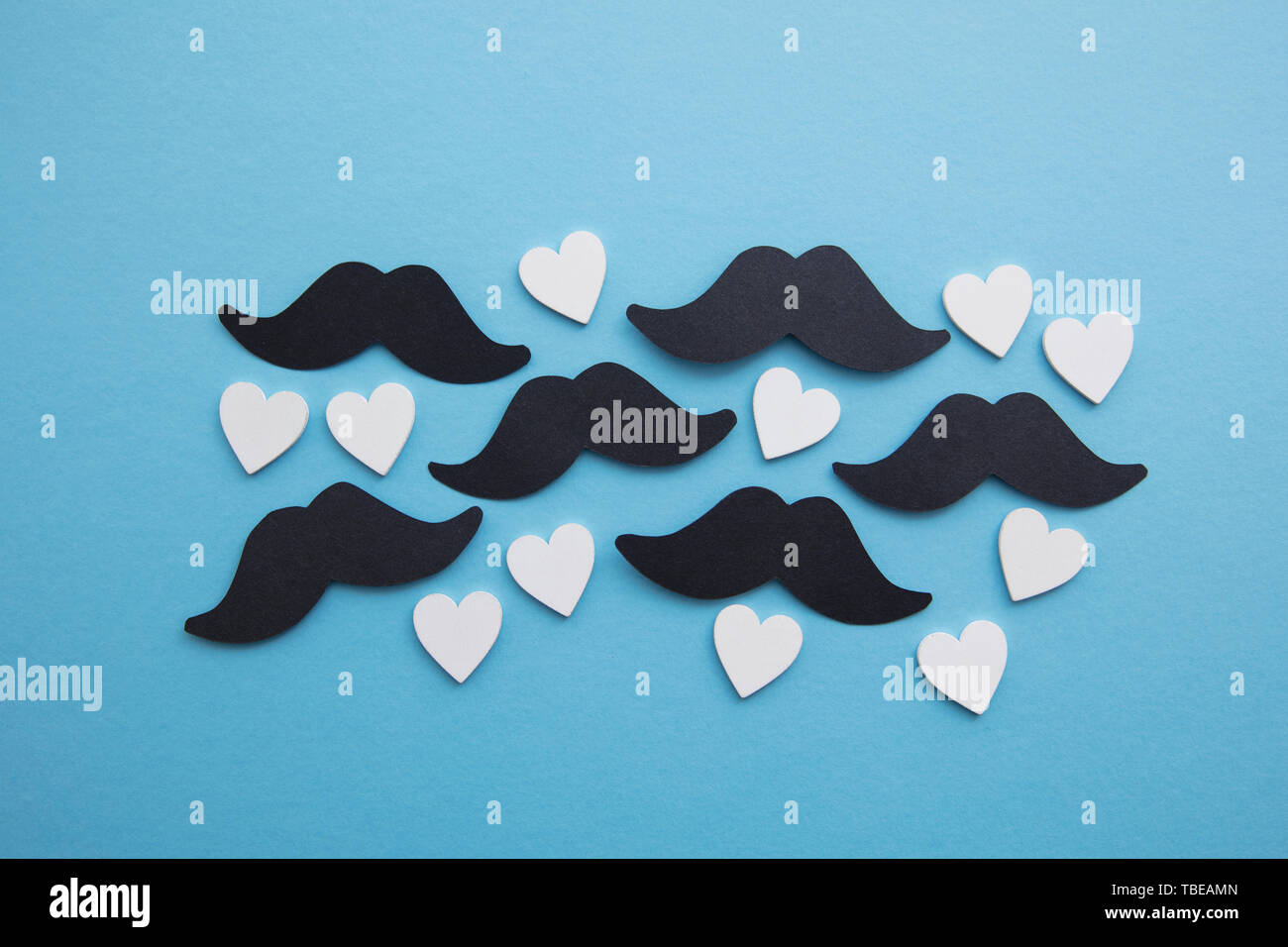 Black mustache with love hearts. Father's day or mens health concept Stock Photo