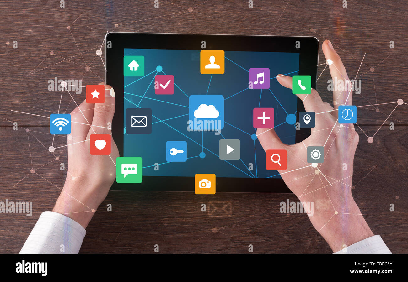 Hand touching multitask tablet with cloud wifi message social media ...