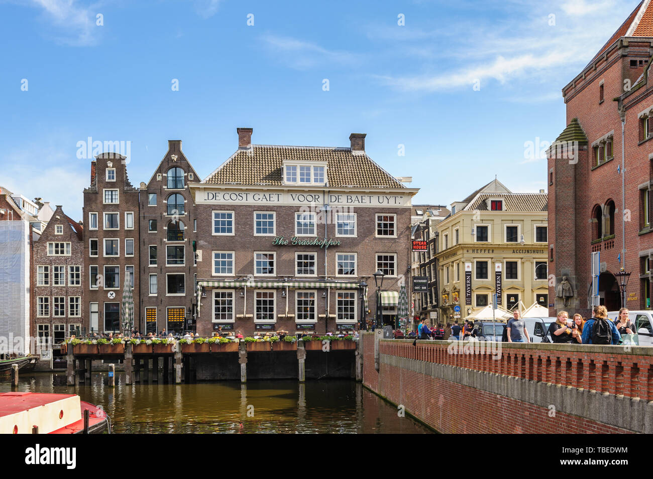 Dancing Canal Houses of Damrak, Amsterdam, Netherlands Stock Photo