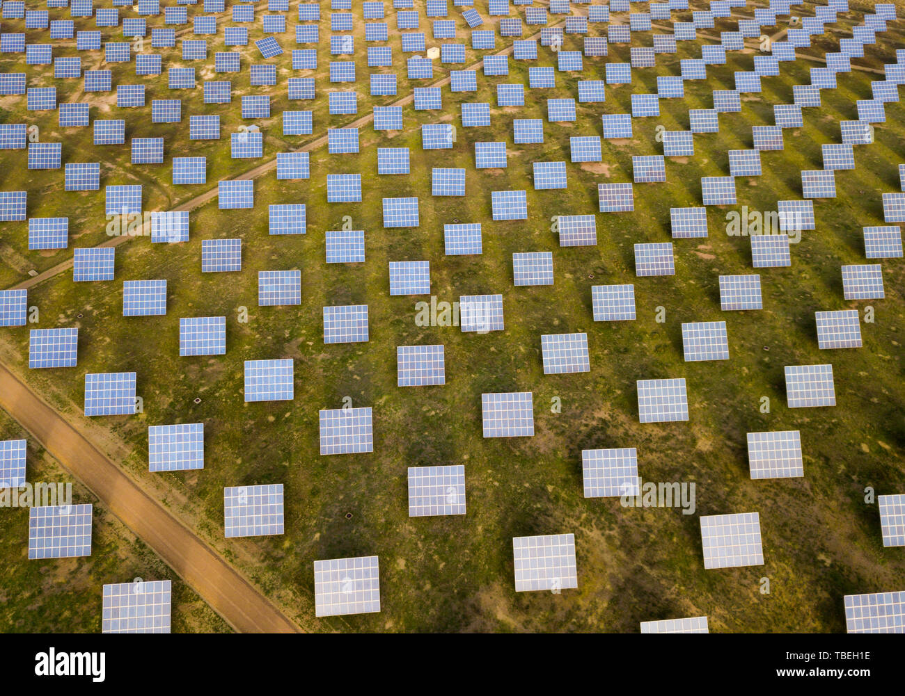Renewable energy – panels of solar power station in green field Stock ...