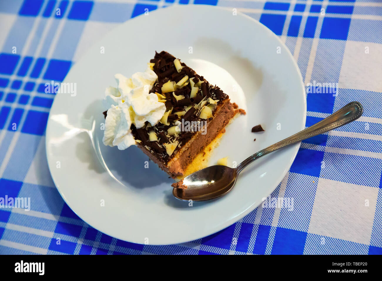 Sweet cake with chocolate and butter cream served at plate Stock Photo ...