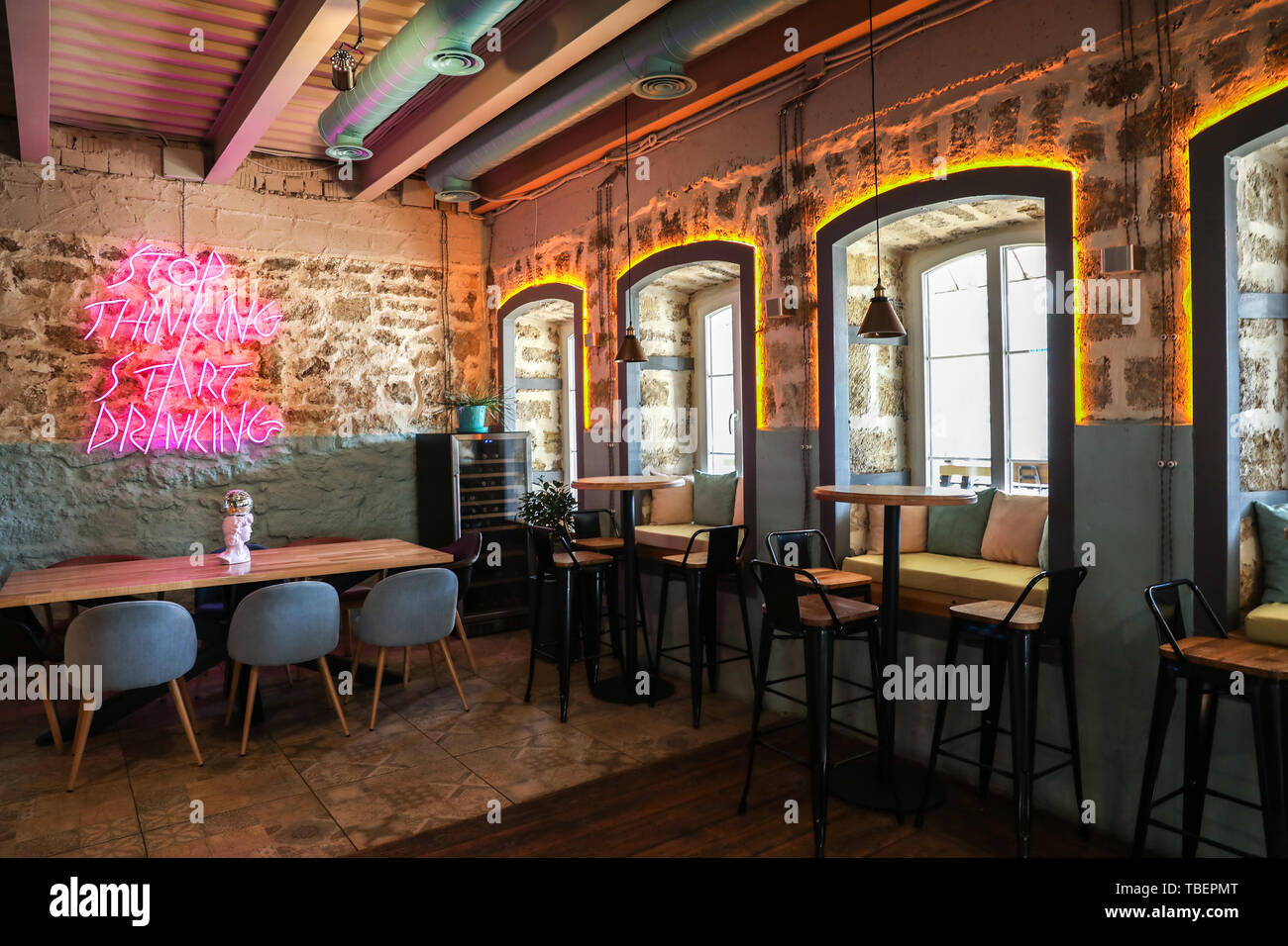 Neon sign on wall in interior of cafe Stock Photo - Alamy