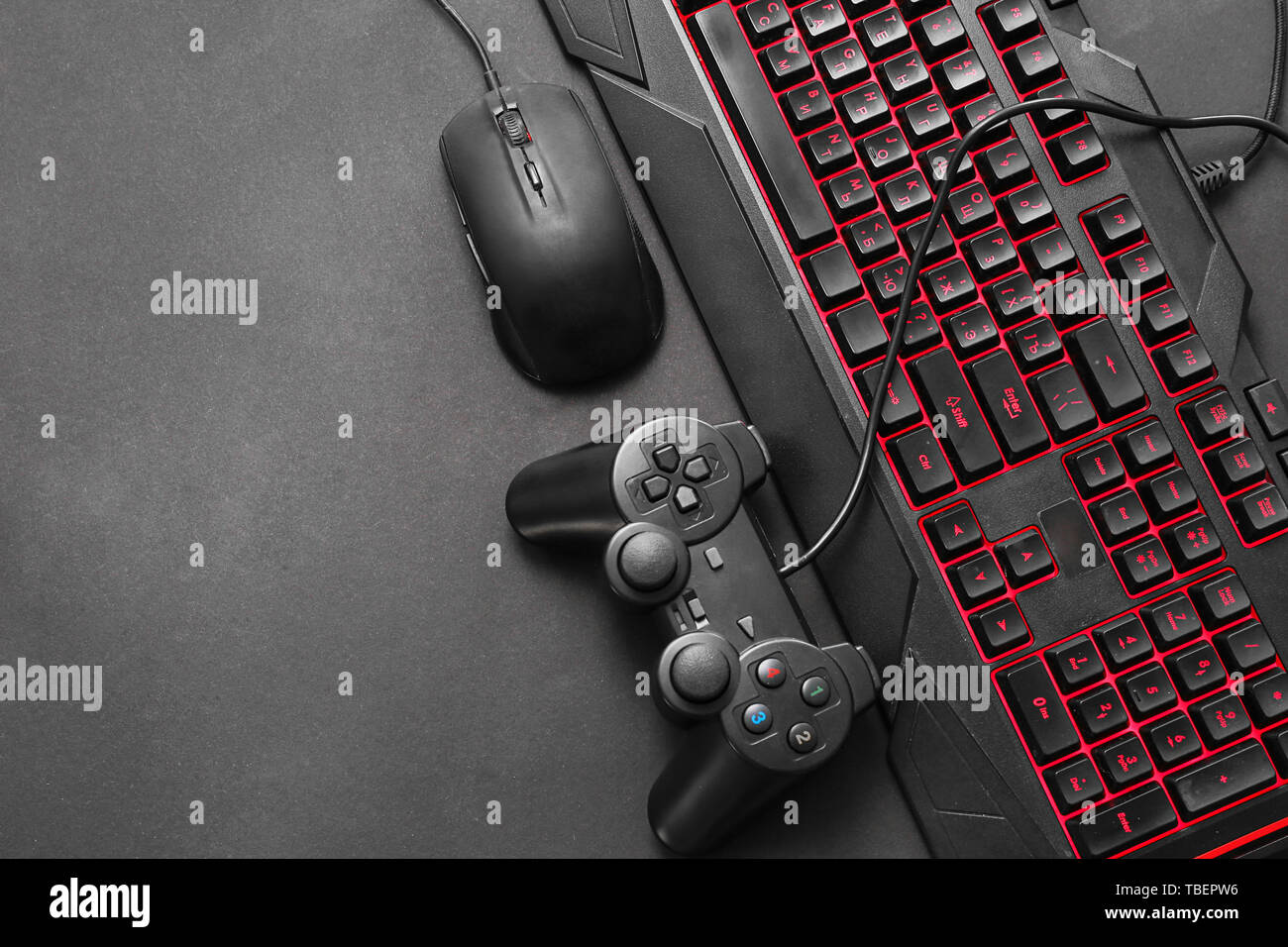 Modern gaming accessories on dark background Stock Photo by