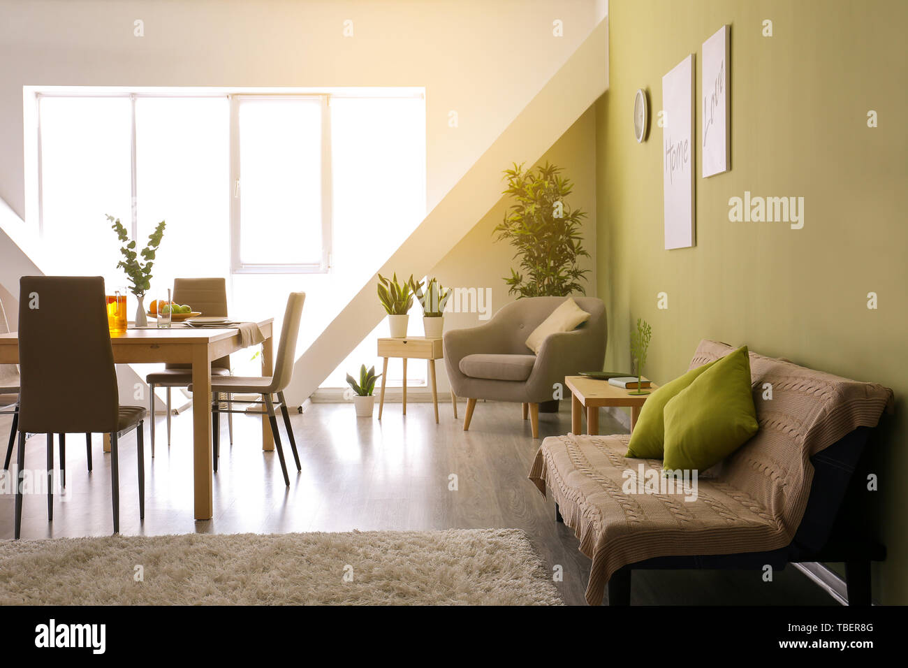 Stylish interior of dining room with served table Stock Photo - Alamy