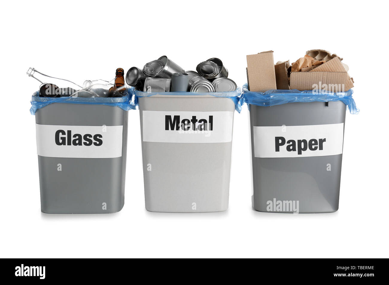 Trash bins with different types of garbage on white background Stock