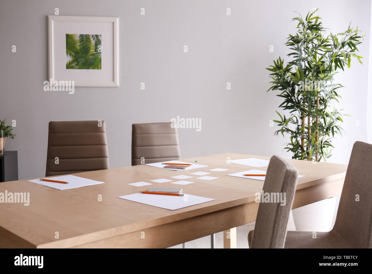 Table with stationery prepared for business meeting in conference hall