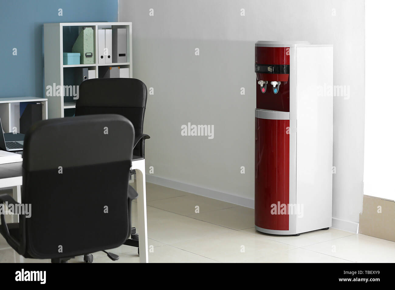 Modern water cooler in office Stock Photo Alamy
