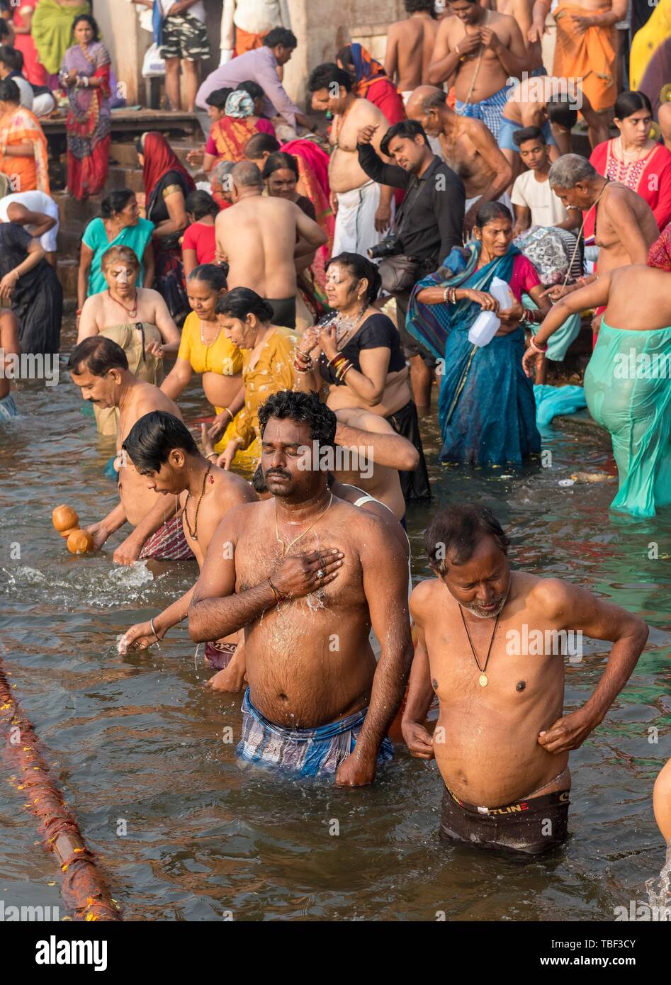 Hindu Worshippers Perform Ritual Bath And Puja Prayers At Ghats In The River Ganges Varanasi 