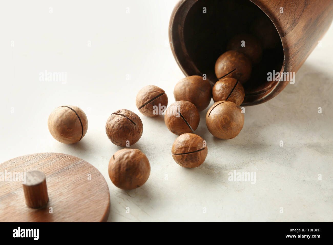 Tasty macadamia nuts on light background Stock Photo