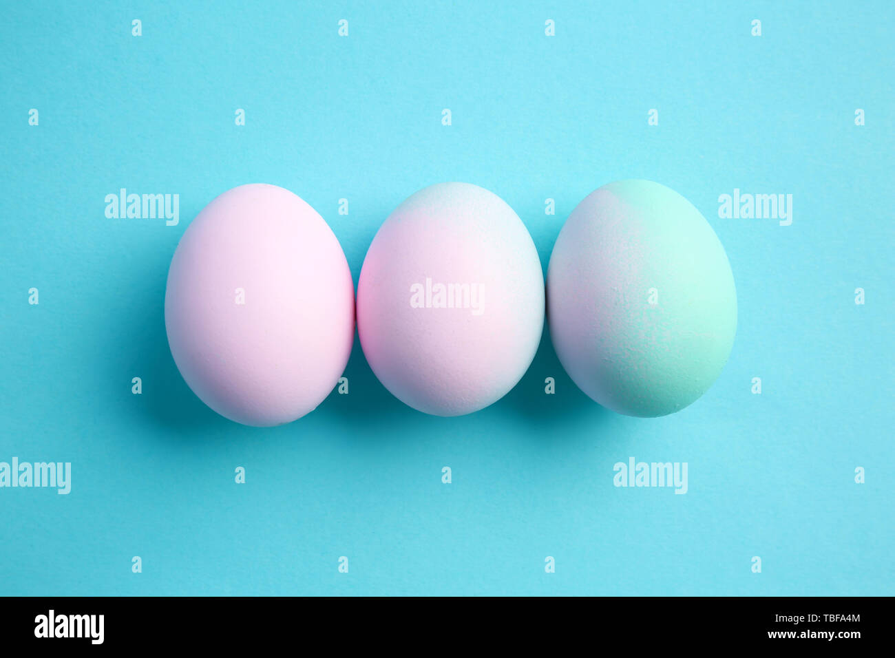 Beautiful Easter eggs on color background Stock Photo