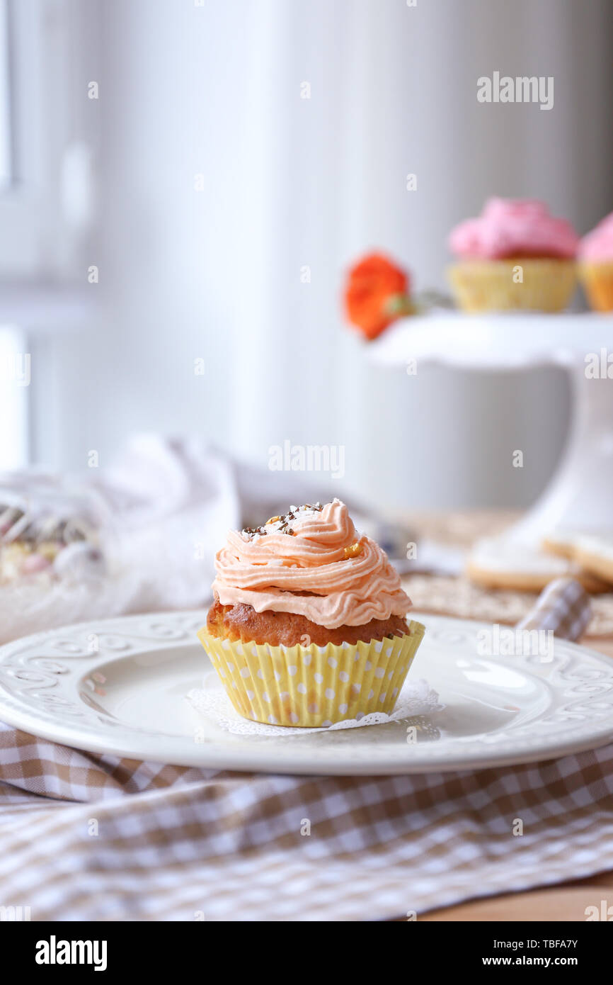 Tasty Easter cupcake on plate Stock Photo