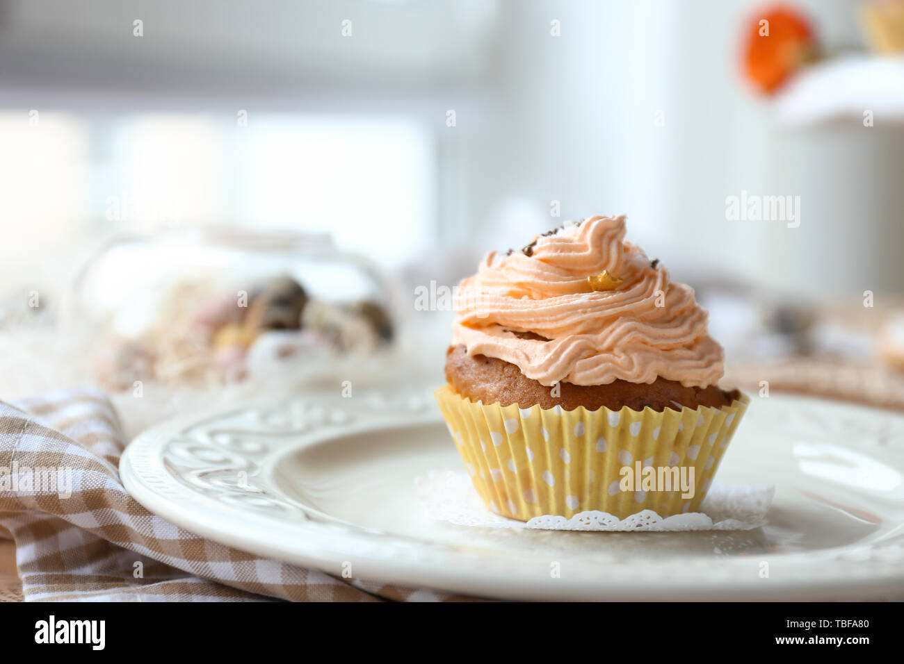 Tasty Easter cupcake on plate Stock Photo