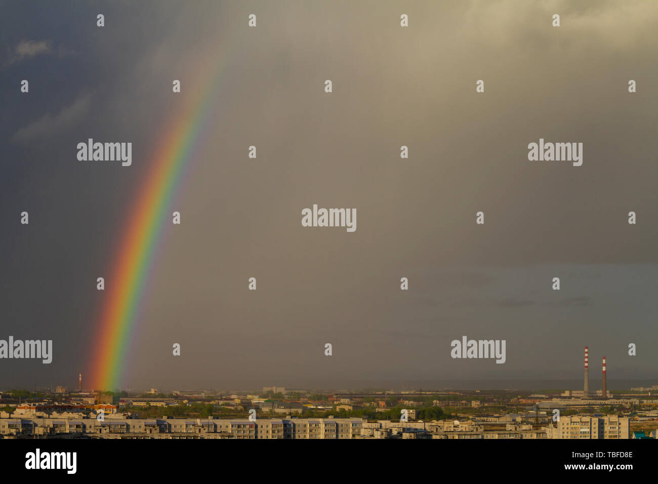 Colorful rainbow over the city after a rain, view from the window Stock ...