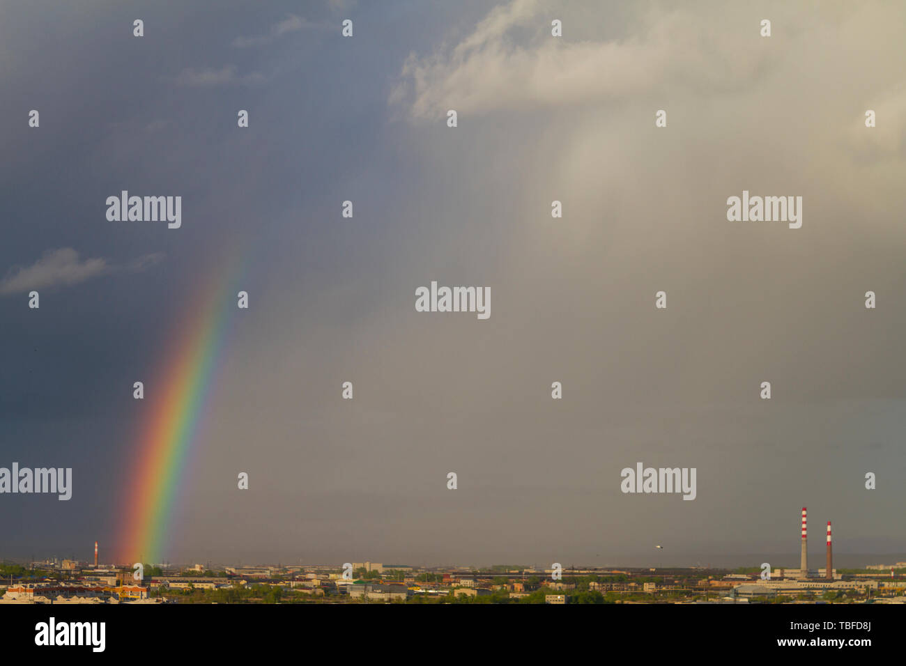 Colorful rainbow over the city after a rain, view from the window Stock ...