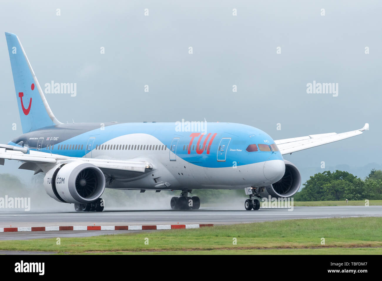 MANCHESTER UK, 30 MAY 2019: TUI Boeing 787-8 Dreamliner flight BY2429 from Dubrovnik lands on runway 23R at Manchaester Airport. Reverse engine thrust Stock Photo