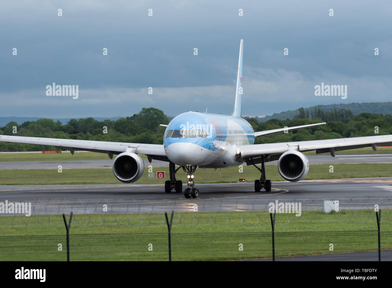 MANCHESTER UK, 30 MAY 2019: TUI Boeing 757 flight BY2447 from Faro turns off runway 23R at Manchaester Airport after landing. Stock Photo