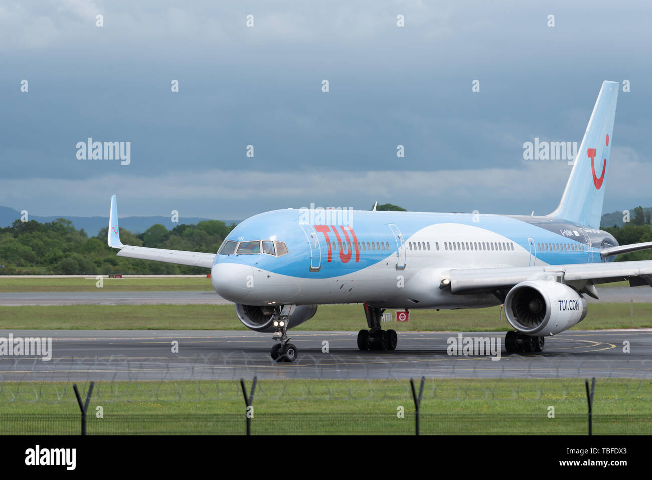 MANCHESTER UK, 30 MAY 2019: TUI Boeing 757 flight BY2447 from Faro turns off runway 23R at Manchaester Airport after landing. Stock Photo