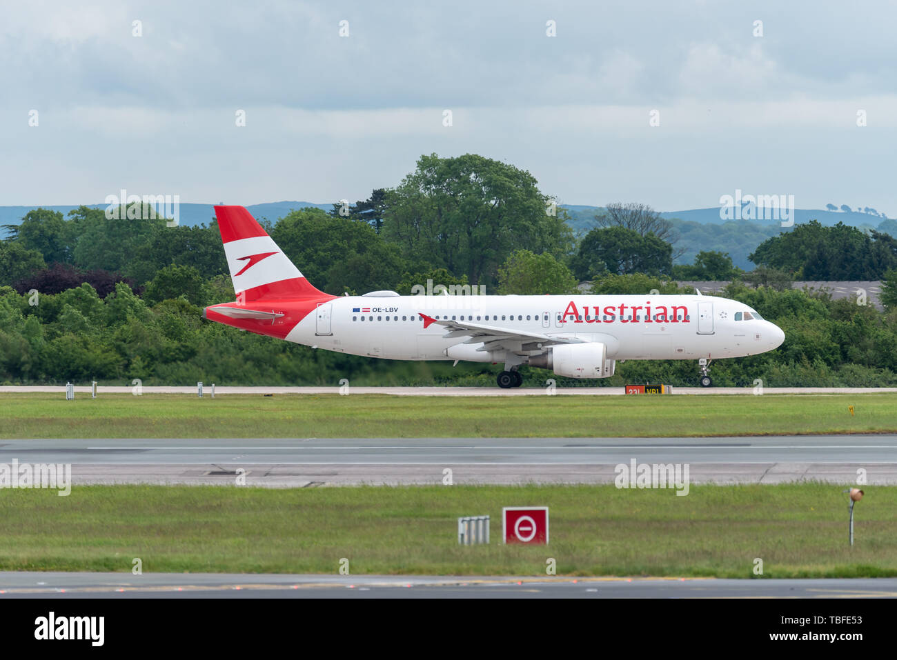 MANCHESTER UK, 30 MAY 2019: Austrian Airlines Airbus A320 flight OS464 to Vienna begins rolling for takeoff on Runway 28L at Manchester Airport. Stock Photo