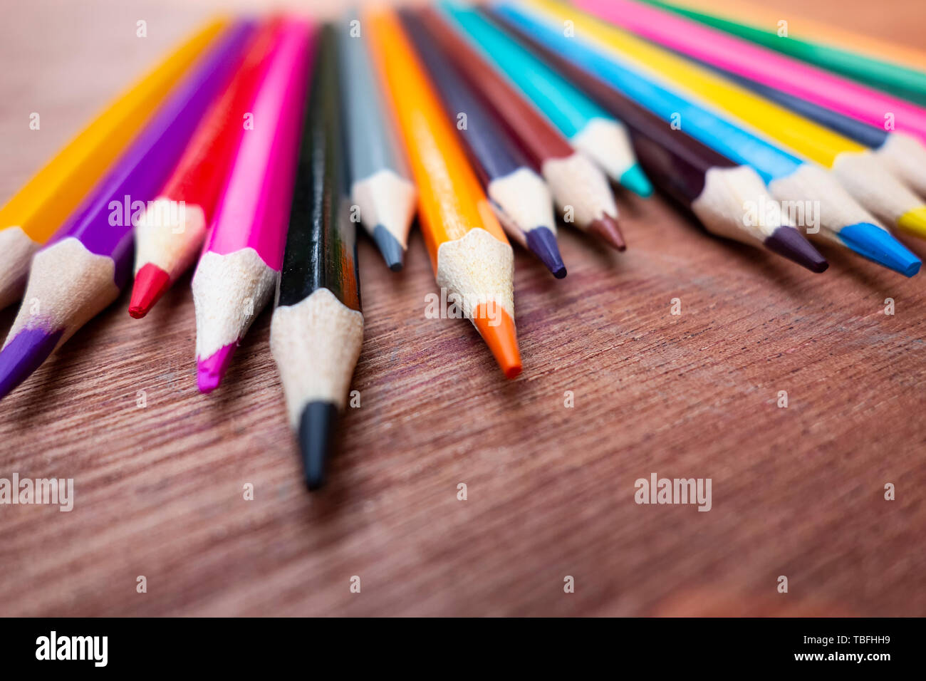 A neatly arranged colored pencil on the table. Stock Photo