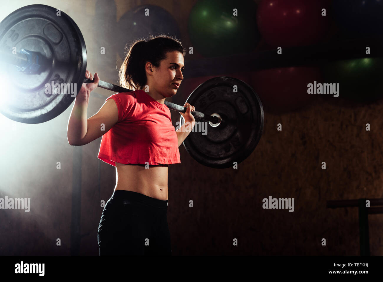 Caucasian female model performing crossfit exercise Stock Photo - Alamy