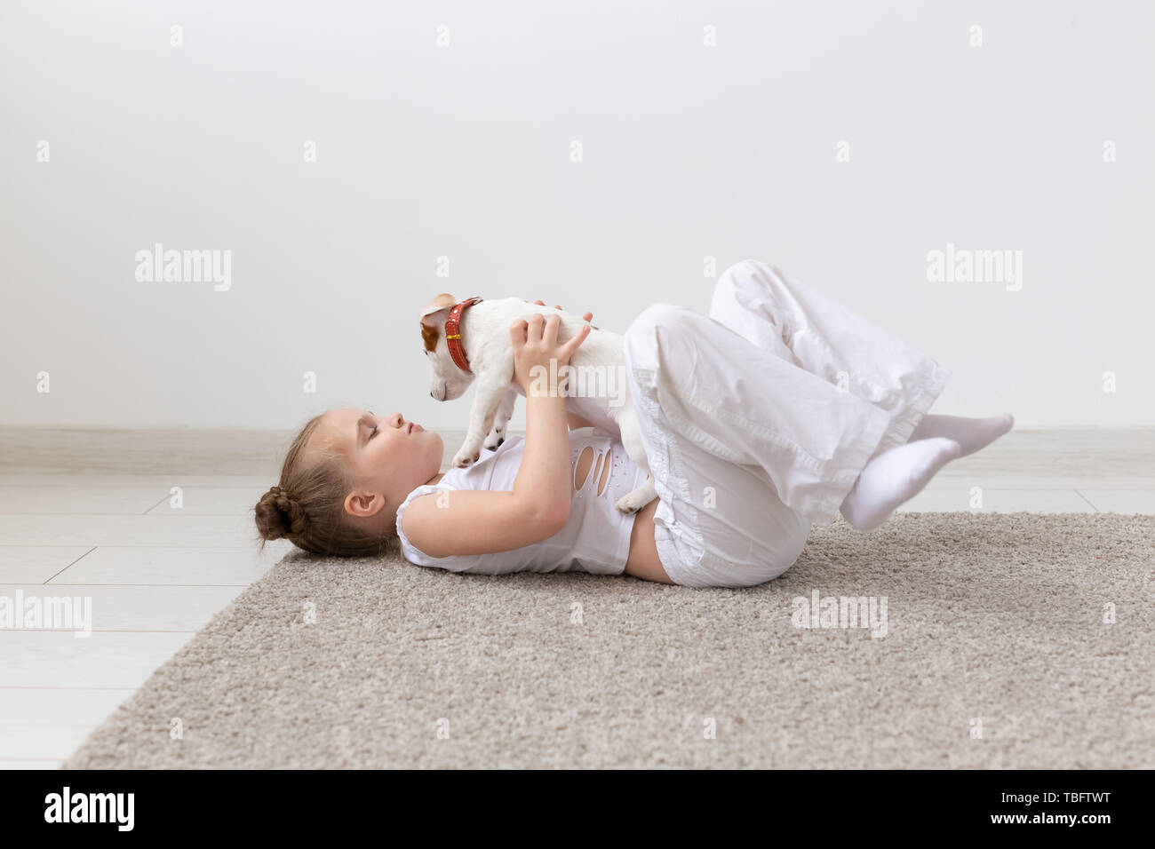 People Children And Pets Concept Little Kid Girl Lying On The