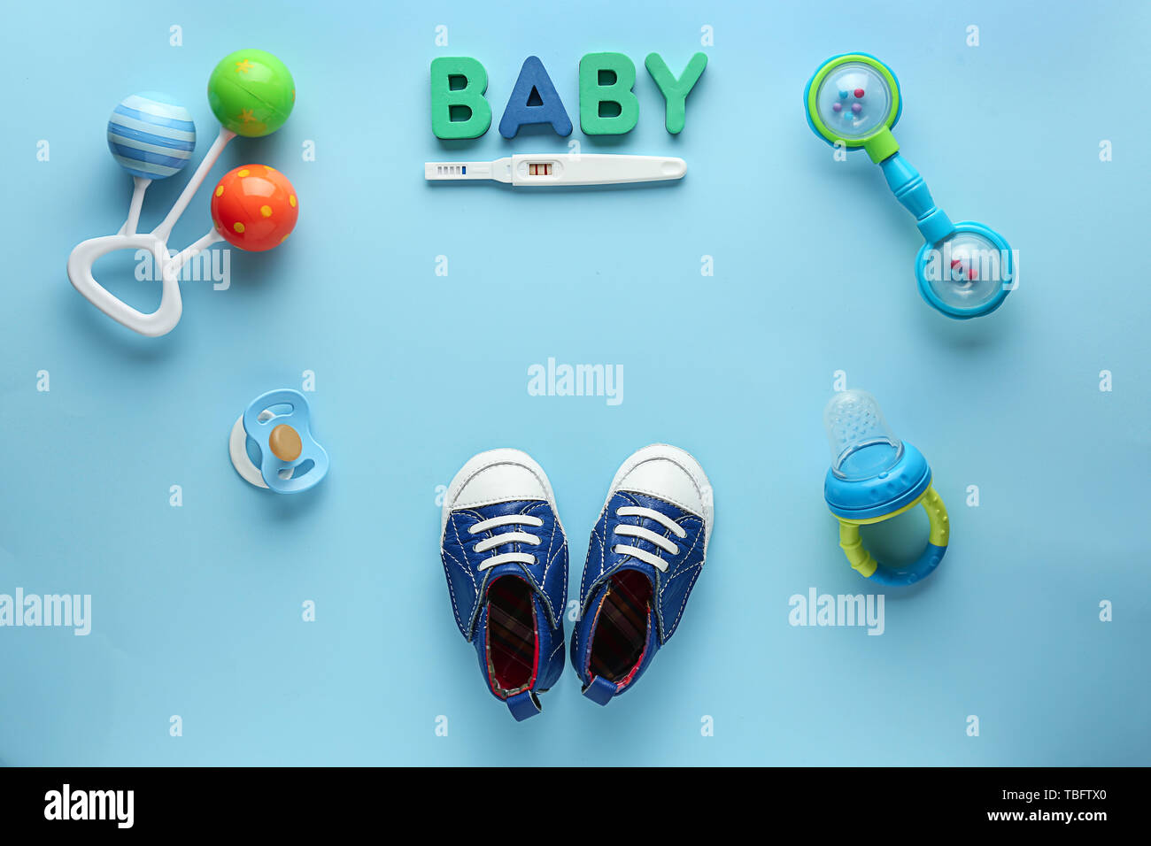 Pregnancy test and baby items on color background Stock Photo ... Pregnancy test and baby items on color background Stock Photo ...