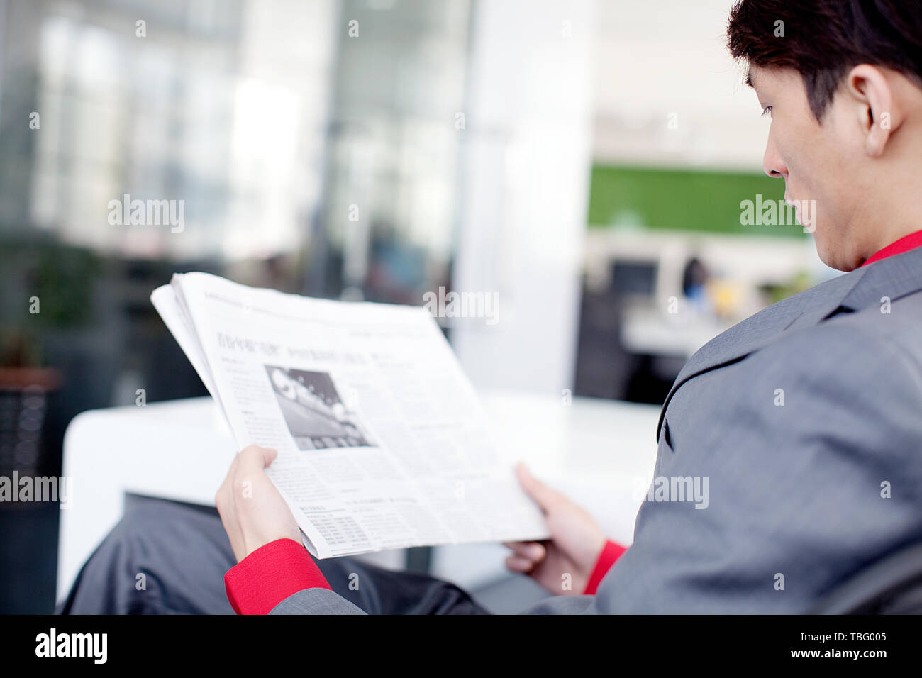 A white-collar worker is busy at work in the office. Stock Photo