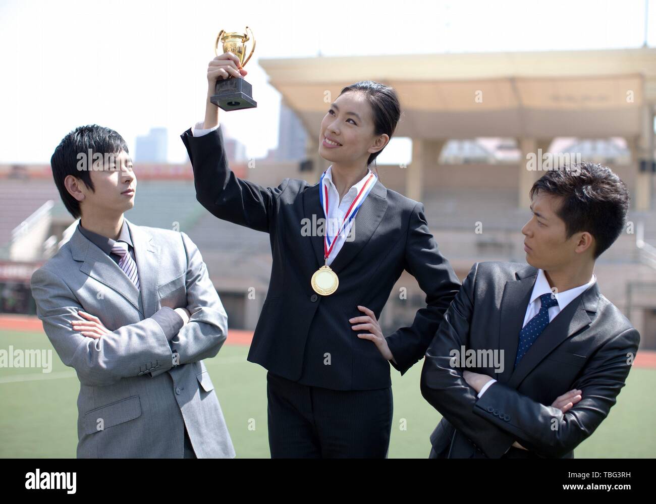 Asian woman gold medal trophy hi-res stock photography and images - Alamy