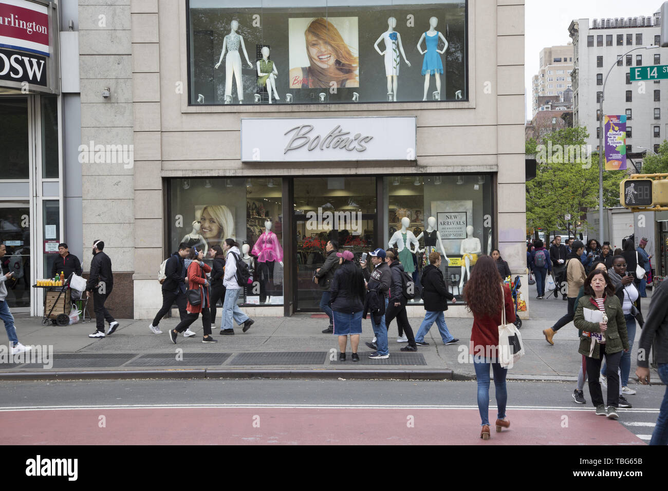 People walk by Bolton's on 14th Street at University Place across from Union Square in New York City. Stock Photo