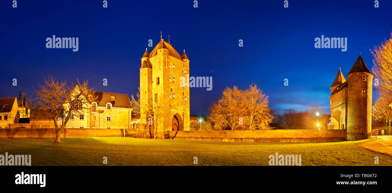 The old Kleve Gate (Klever Tor) in Xanten, Germany. Panoramic night shot with blue sky. Stock Photo