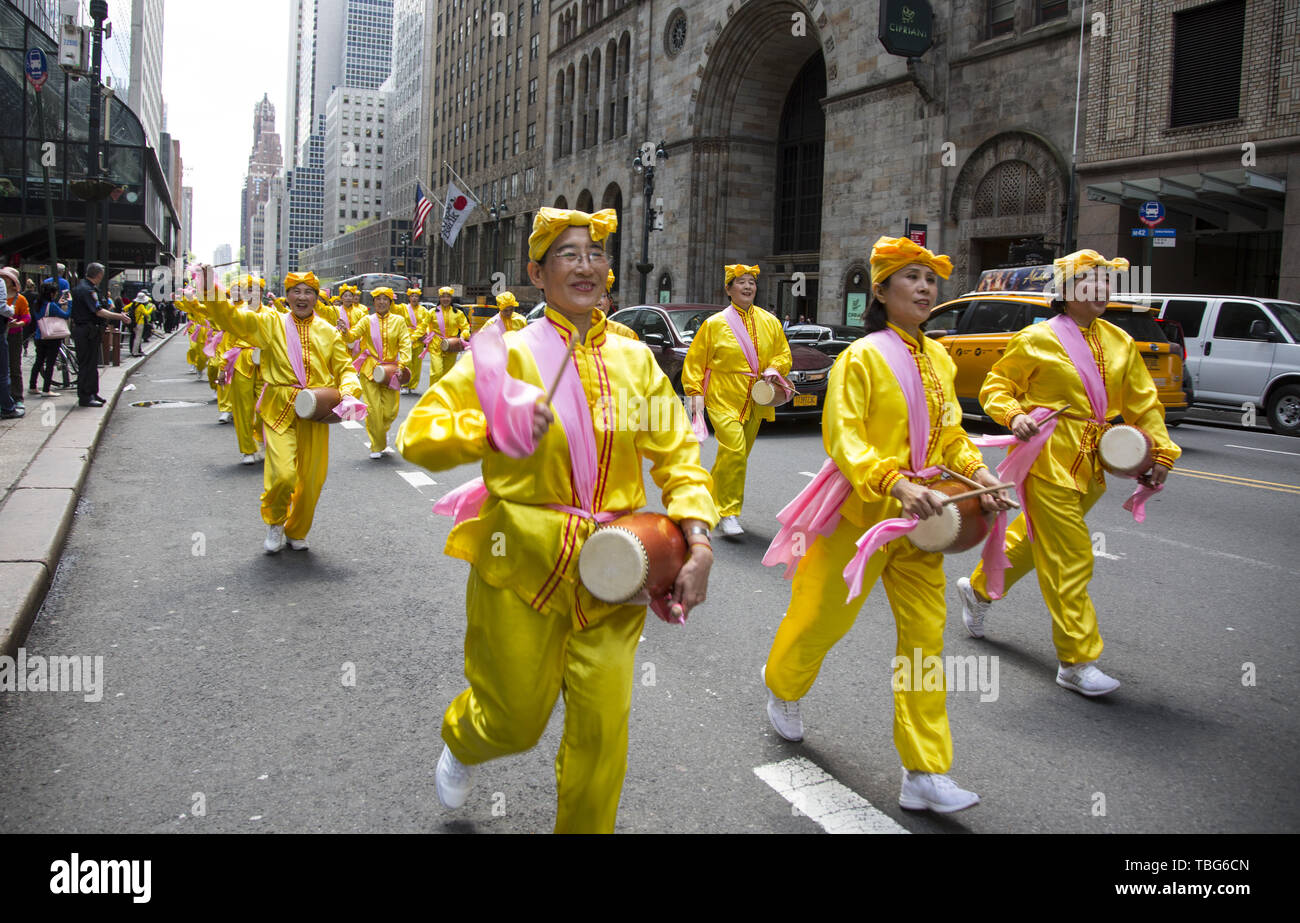 International members of Falun Dafa march from the UN to the Chinese Consulate in NYC demanding the end of the persecution of its members in China. Falun Dafa also Falun Gong Standard Mandarin Chinese: [fàlwə̌n tâfà]; literally, 'Dharma Wheel Practice' or 'Law Wheel Practice') is a Chinese religious spiritual practice that combines meditation and qigong exercises with a moral philosophy centered on the tenets of truthfulness, compassion, and forbearance (Chinese: 真、善、忍). The practice emphasizes morality and the cultivation of virtue, and identifies as a qigong practice of the Buddhist schoo Stock Photo