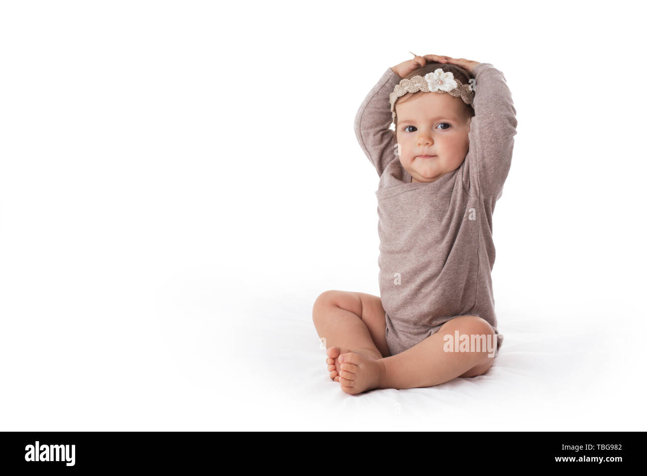 Cute eight month baby girl portrait on white background Stock Photo