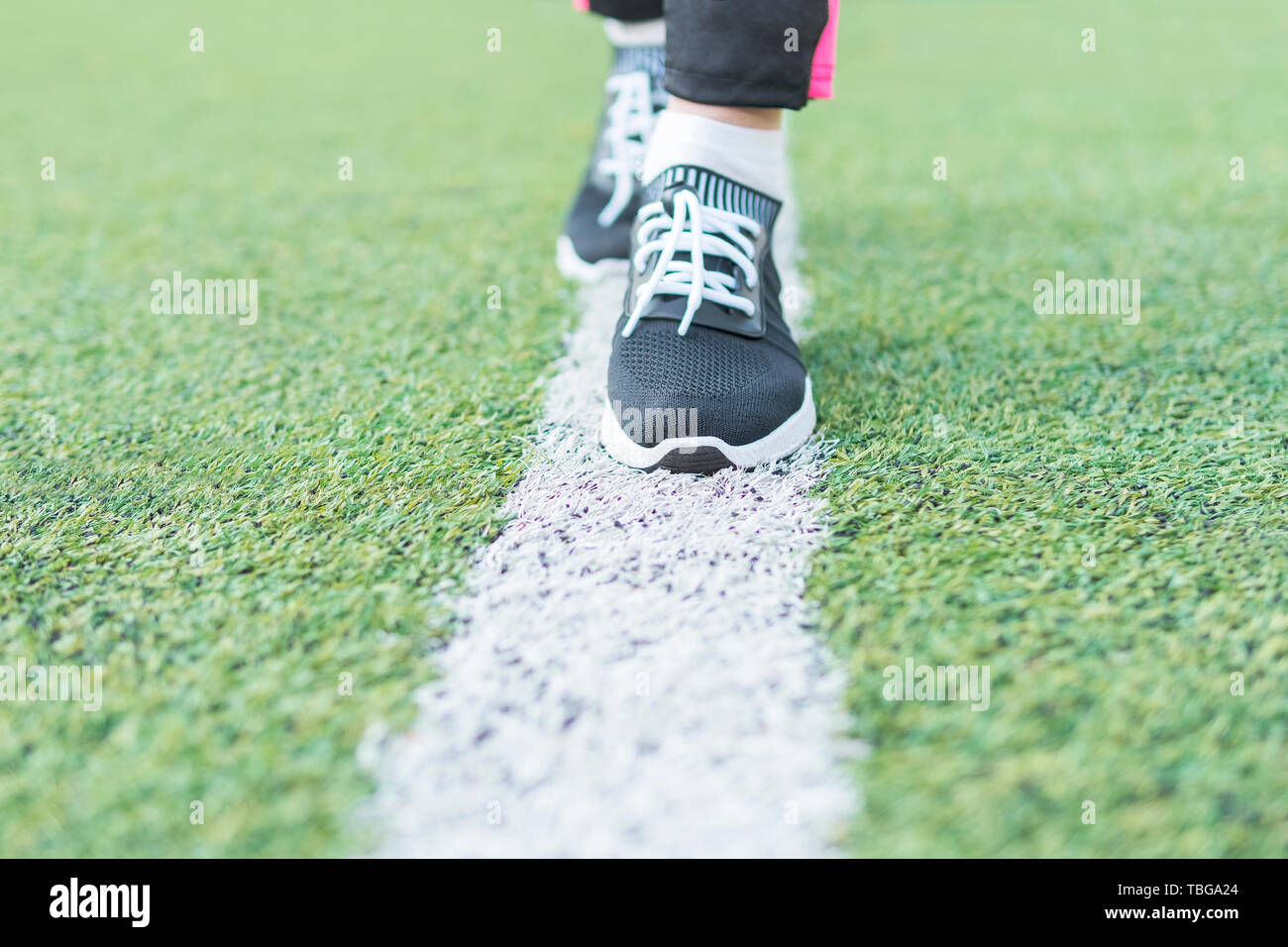 foot on artificial grass Stock Photo Alamy