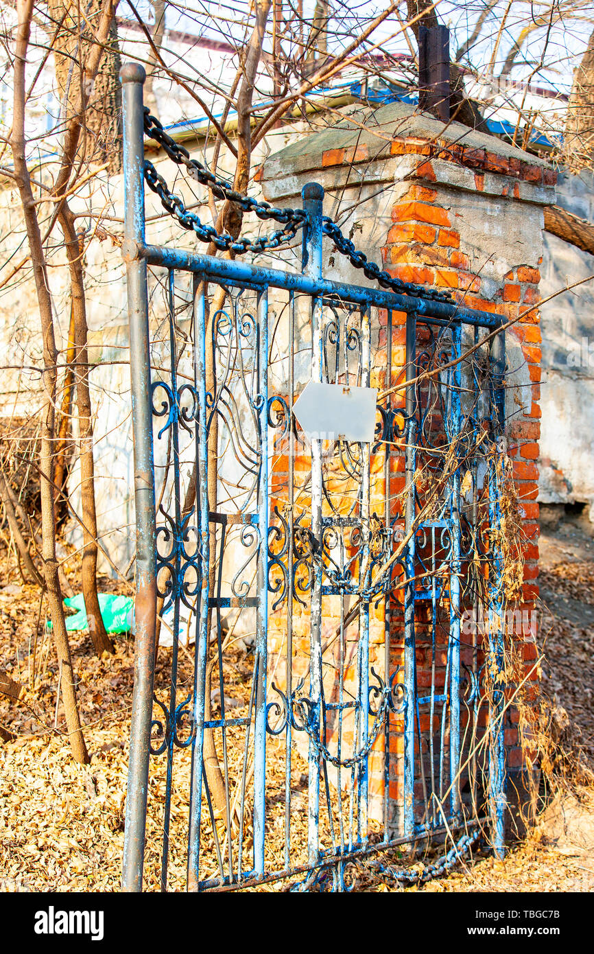 The opened old retro of rusty metal slide door Stock Photo - Alamy