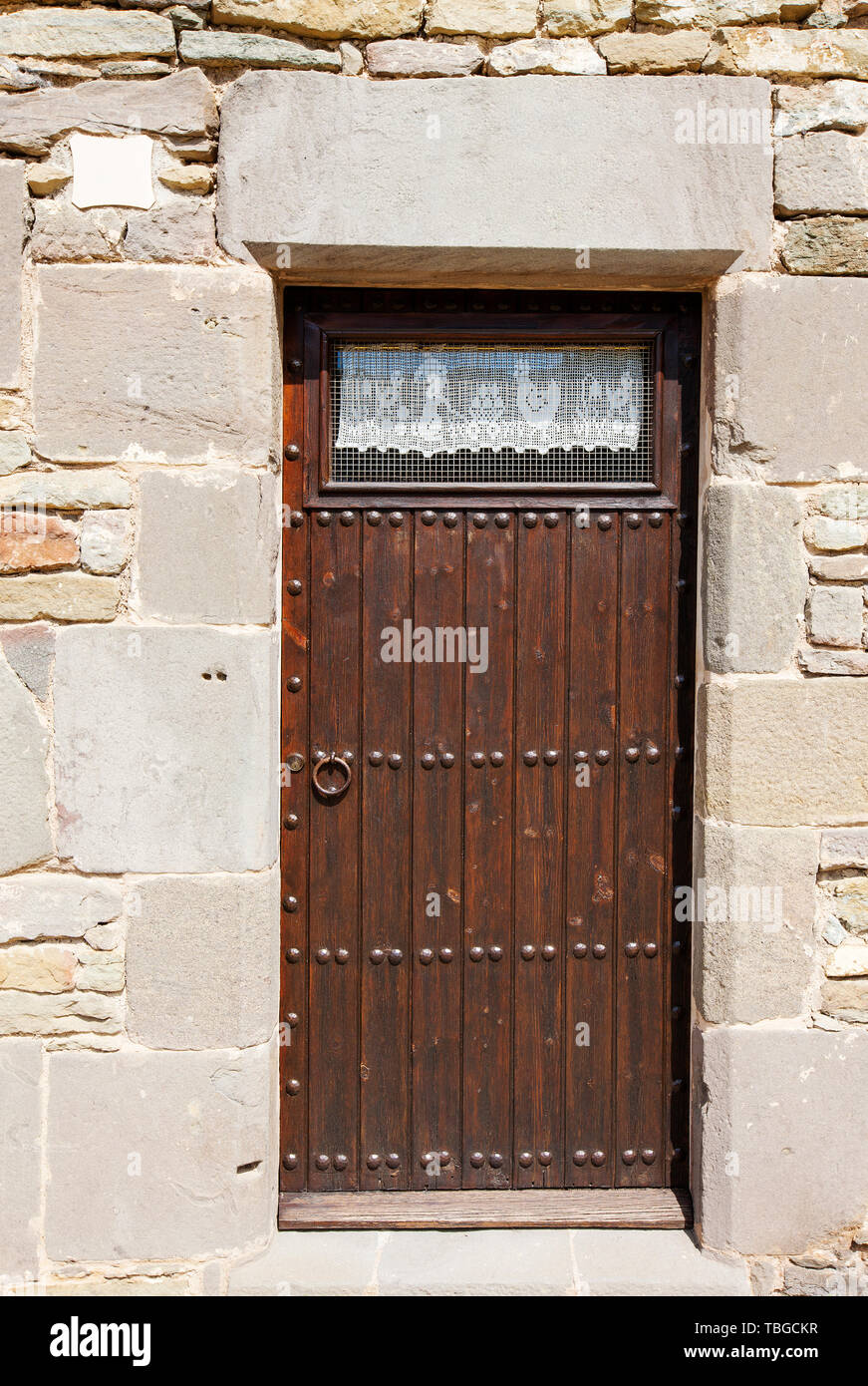 old wooden door of a stone house Stock Photo - Alamy