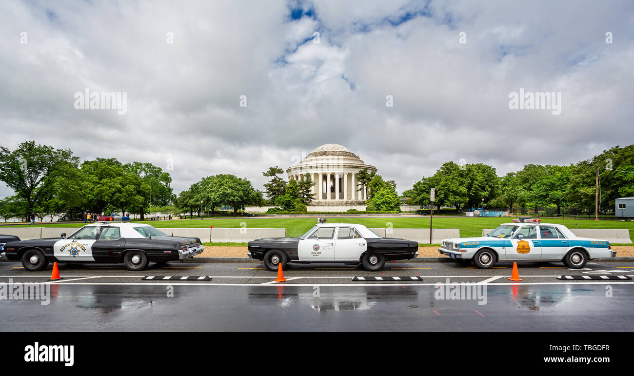 Trio of vintage American  Police Cars parked outside The Jefferson Memorial in Washington DC, USA on 13 May 2019 Stock Photo