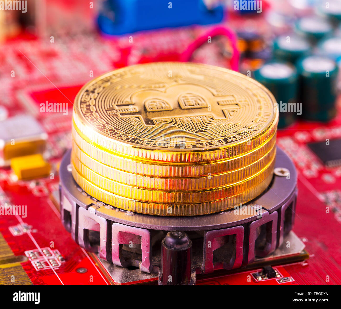 bitcoin concept - gold coin, computer circuit Board with bitcoin