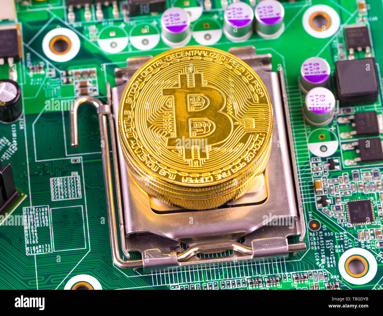 bitcoin concept - gold coin, computer circuit Board with bitcoin ...