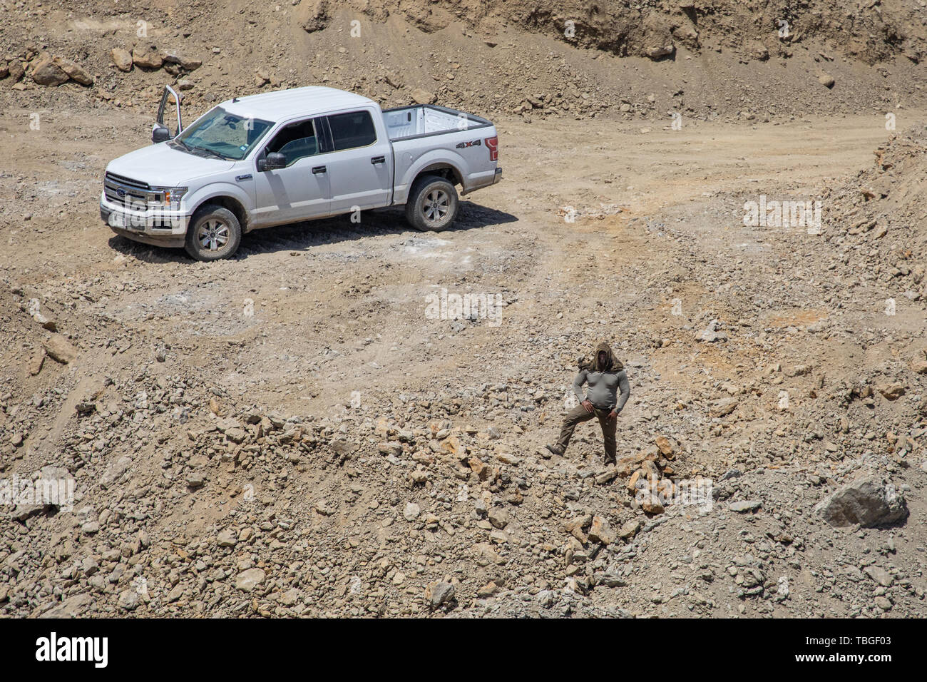 A member of the Guardian Patriots (United Constitutional  Patriots) surveils the We Build The Wall construction site near El Paso Texas. The paramilit Stock Photo
