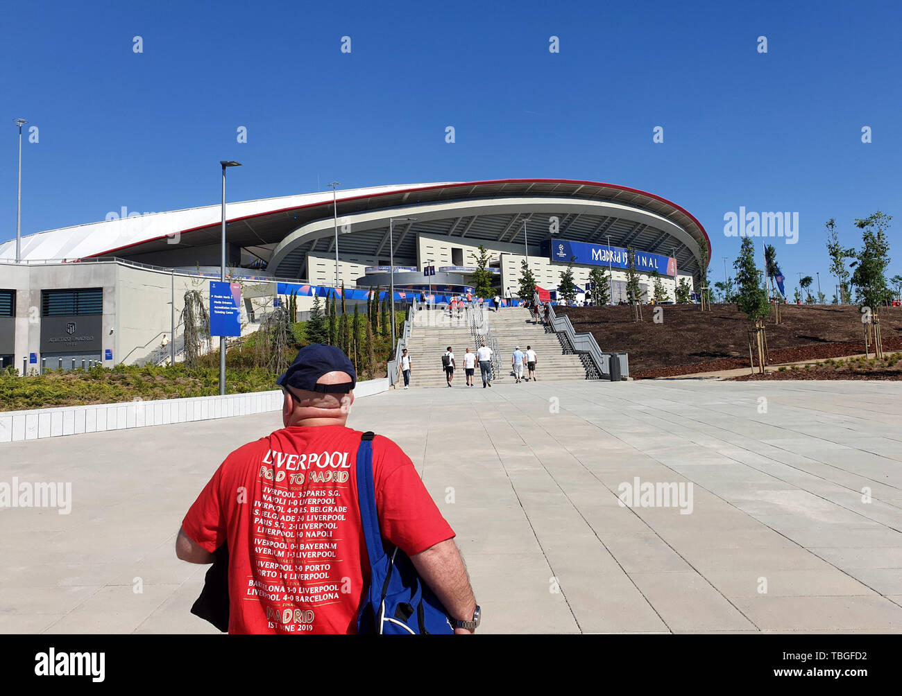 Liverpool fans approach the Estadio Metropolitano stadium known as the Wanda metropolitano home of Atletico Madrid on the morning of the UEFA Champions League Final, 1st June 2019. Stock Photo