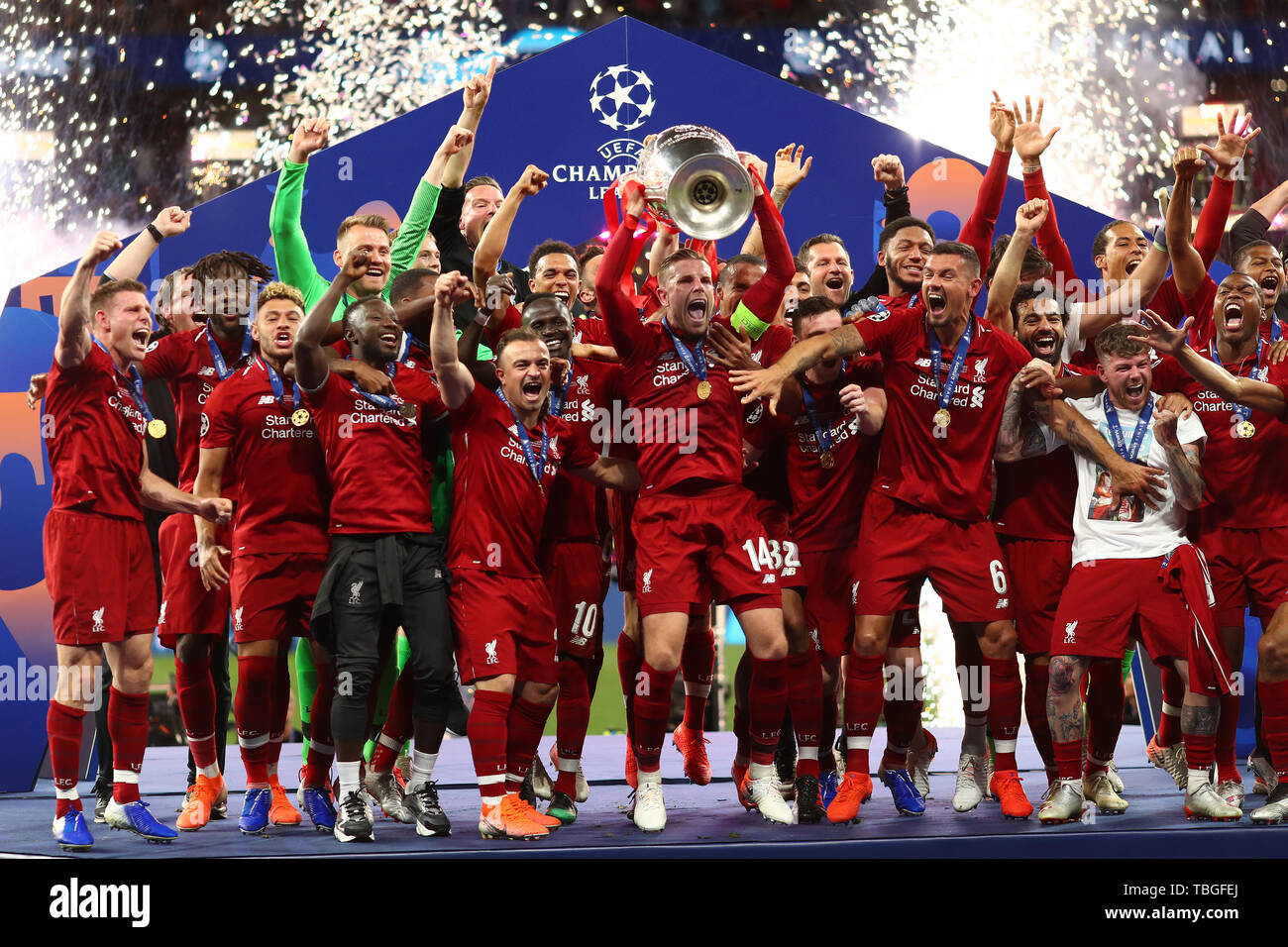 Jordan Henderson of Liverpool lifts the trophy into the air in celebration  after winning the UEFA Champions League - Tottenham Hotspur v Liverpool,  UEFA Champions League Final 2019, Wanda Metropolitano Stadium, Madrid -