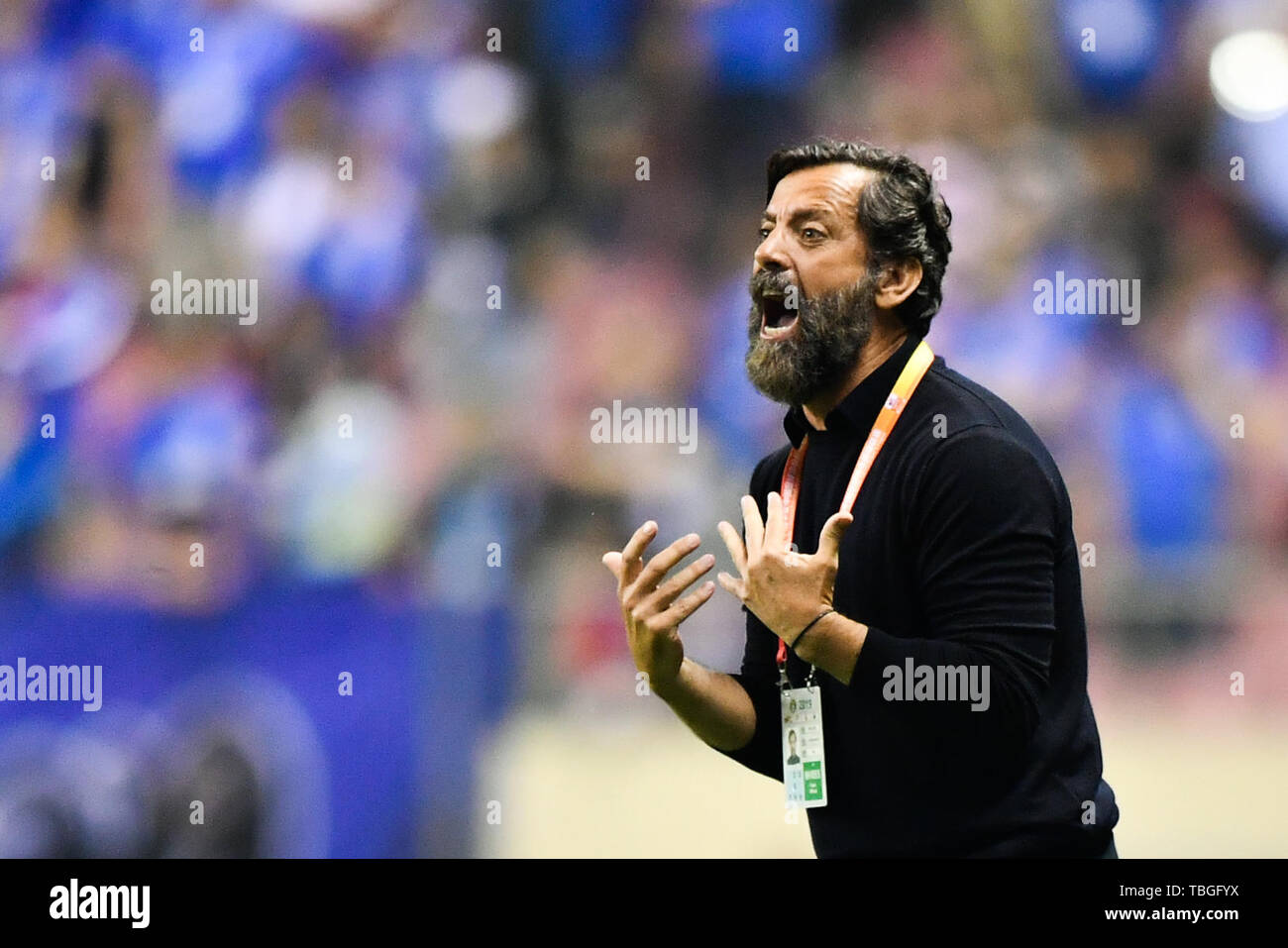 Head coach Quique Sanchez Flores of Shanghai Greenland Shenhua shouts instructions to his players as they compete against Chongqing SWM in their 12th round match during the 2019 Chinese Football Association Super League (CSL) in Shanghai, China, 1 June 2019.  Shanghai Greenland Shenhua played draw to Chongqing SWM 0-0. Stock Photo