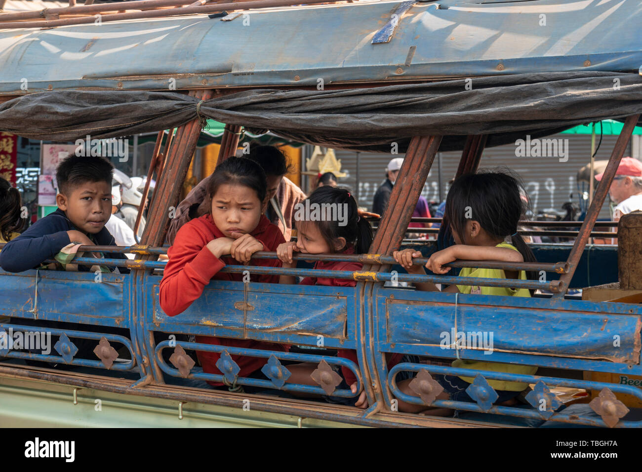 Kids waiting in a local bus at Daoheuang Market in Pakse, Laos Stock Photo