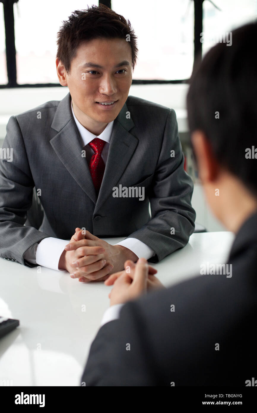 Professional interview scene asian hi-res stock photography and images ...