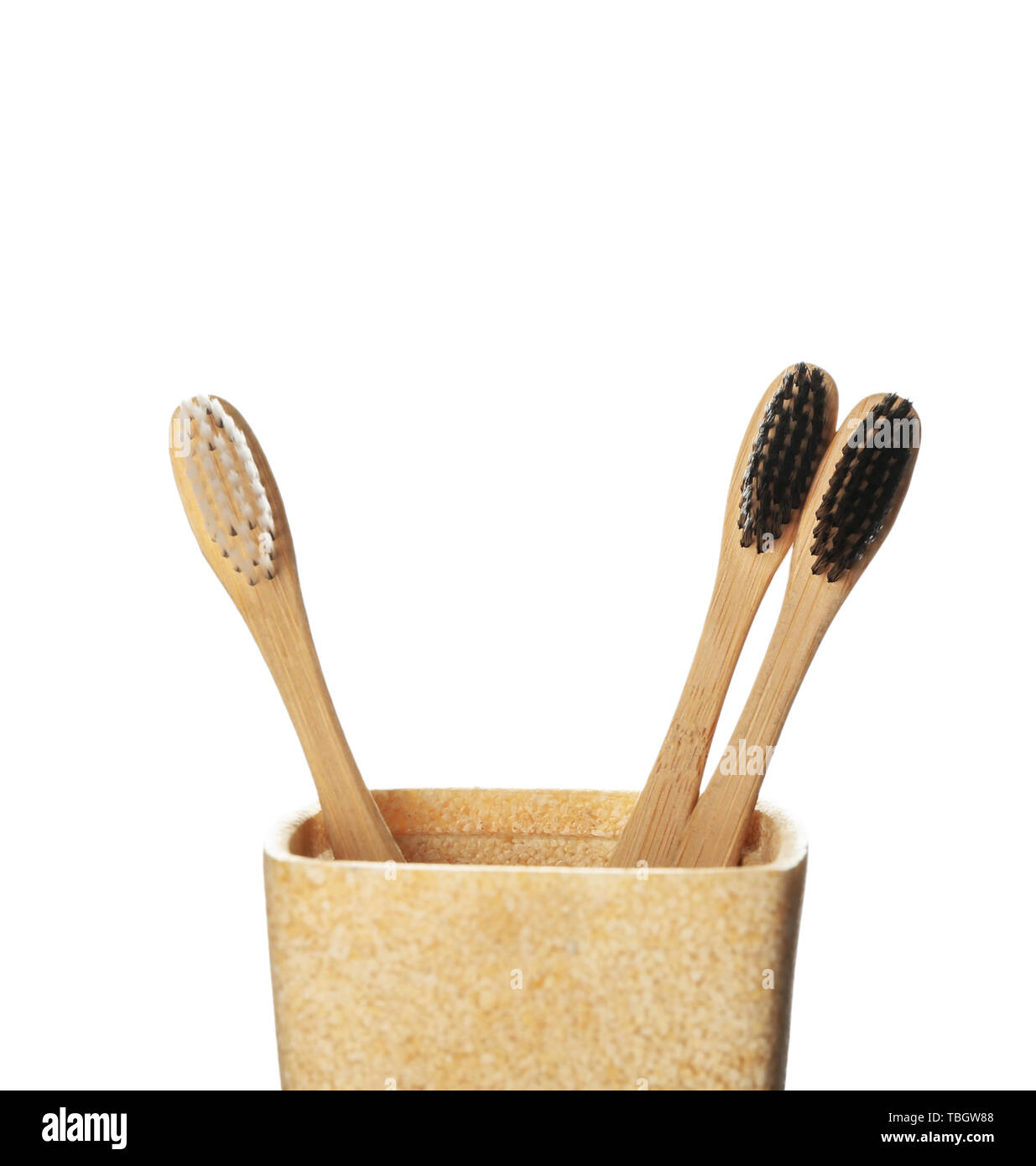 Holder with toothbrushes on white background Stock Photo - Alamy