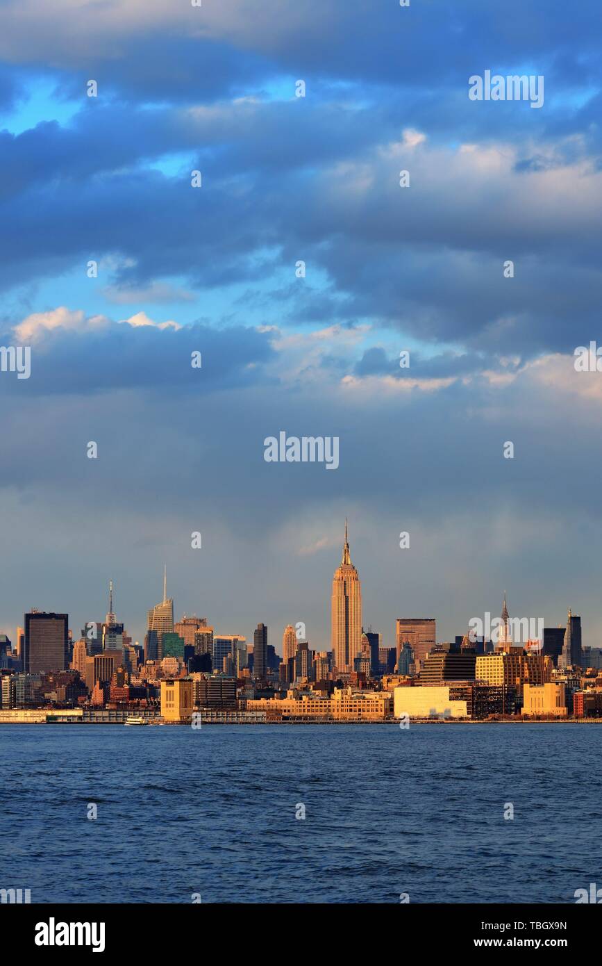Downtown Manhattan skyline at sunset over Hudson River in New York City ...